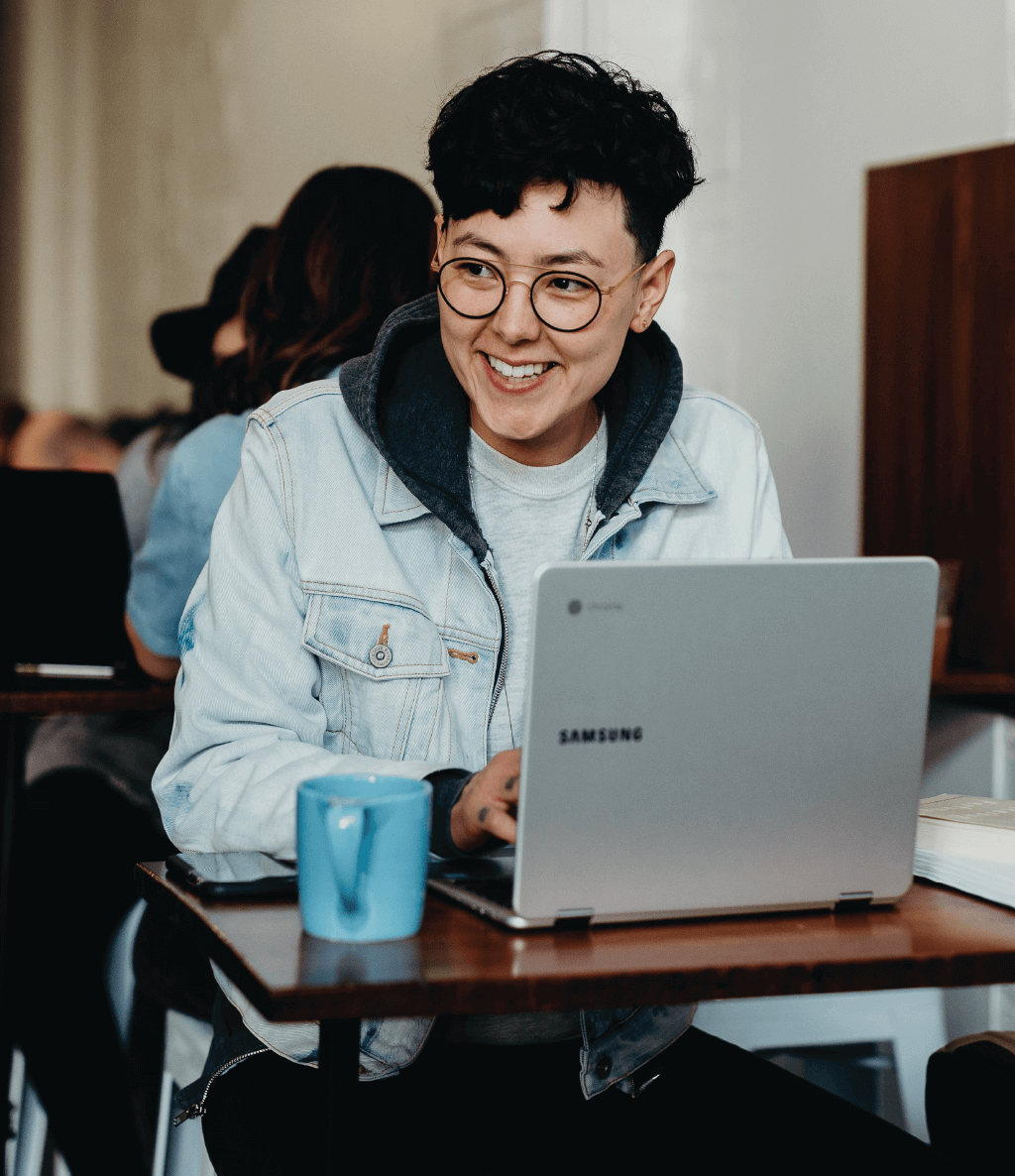 young male happy on laptop